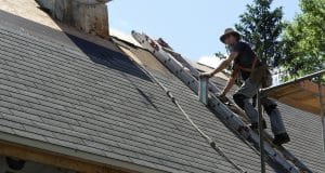 roofer with shingles